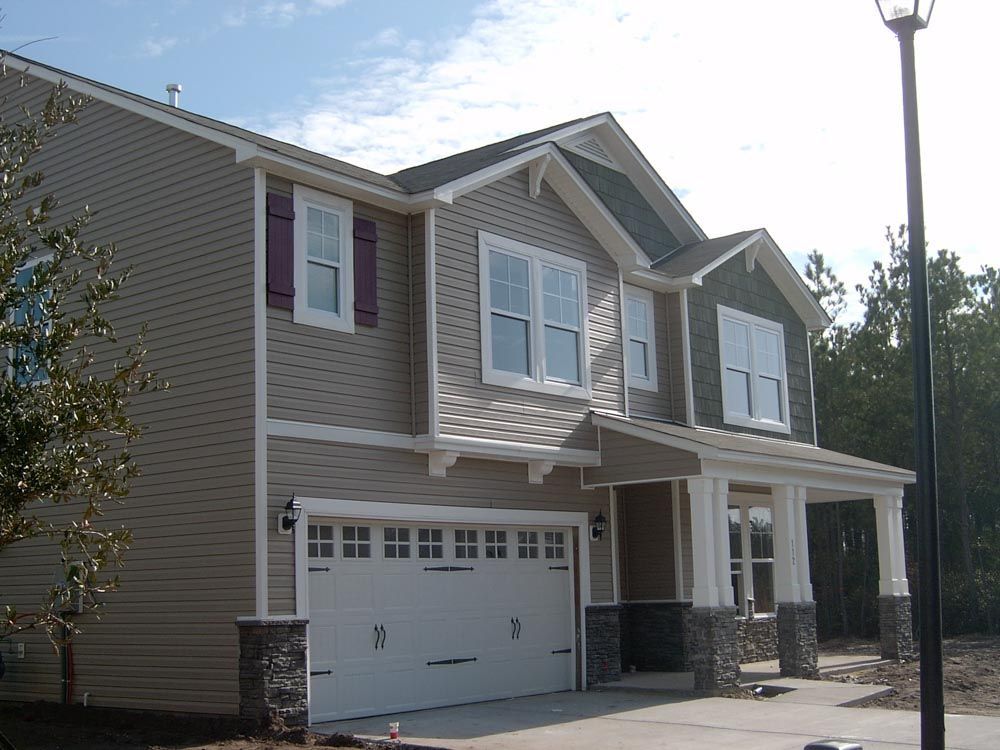A large house with a white garage door