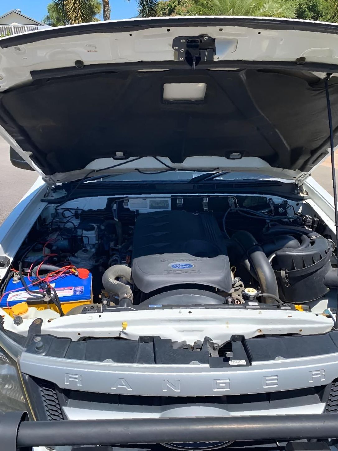 The Hood Of A White Truck Is Open And The Engine Is Visible — Downsy's Cars In Bentley Park, QLD