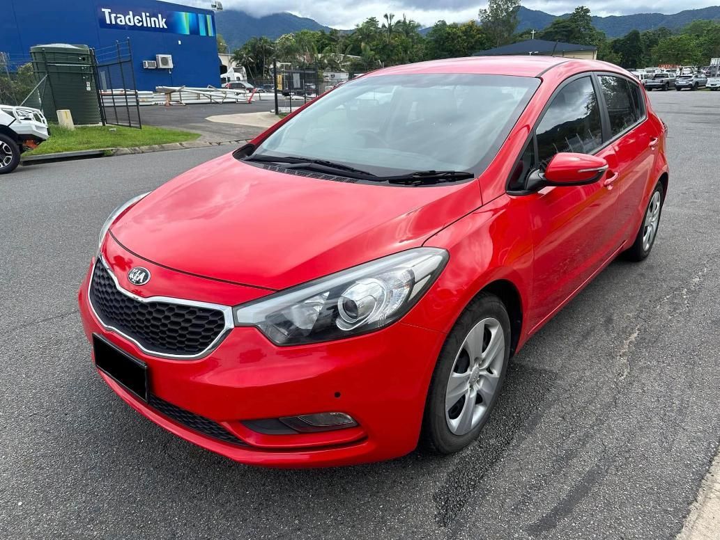 A Red Car Is Parked On The Side Of The Road — Downsy's Cars In Bentley Park, QLD