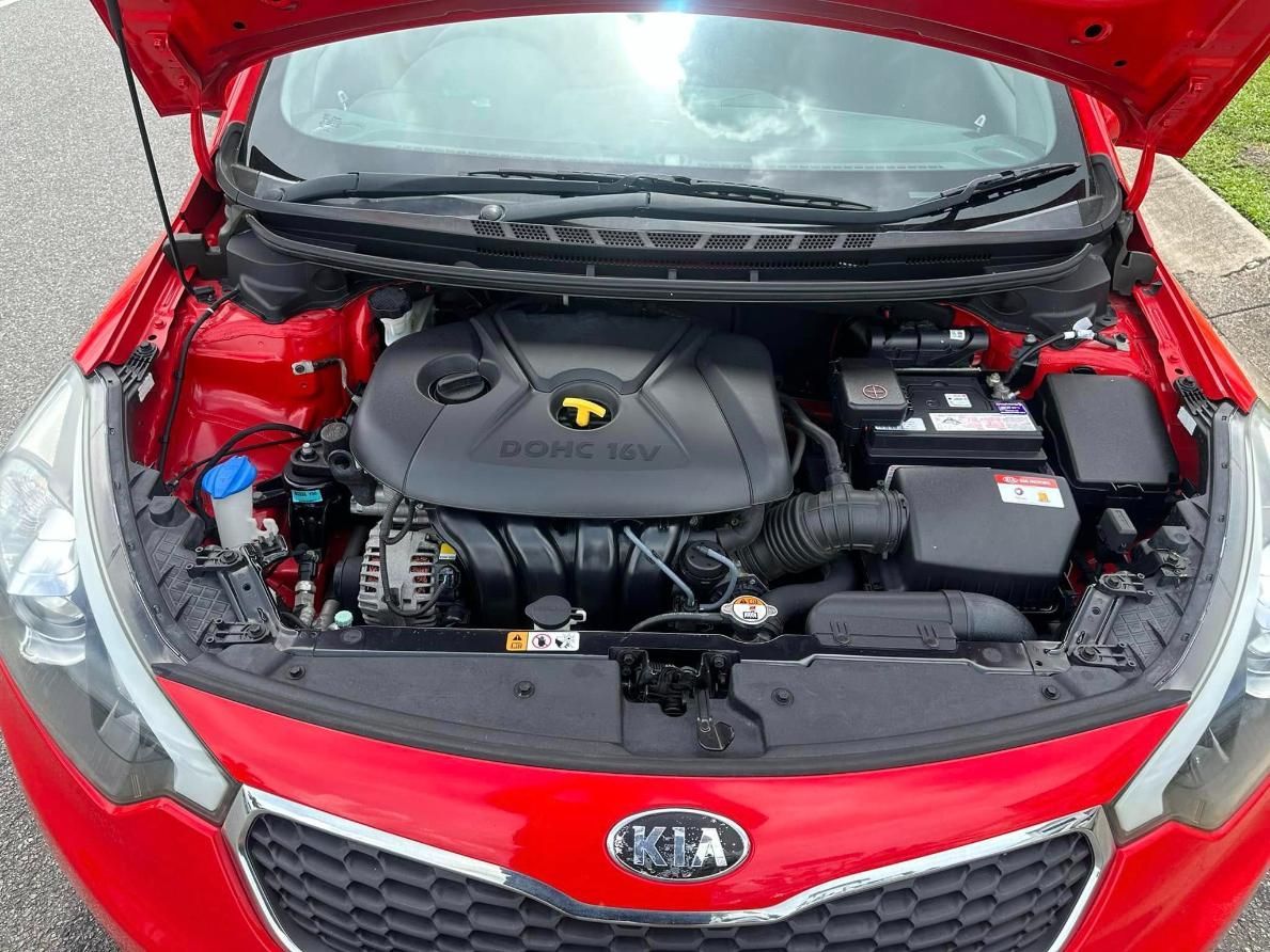Open Hood Of A Red Kia Showing A Clean Engine Bay — Downsy's Cars In Cairns, QLD