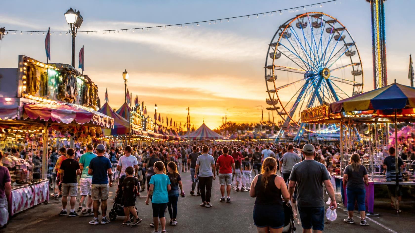 The Big E Fair with Ferris wheel, midway rides, food vendors, and crowds