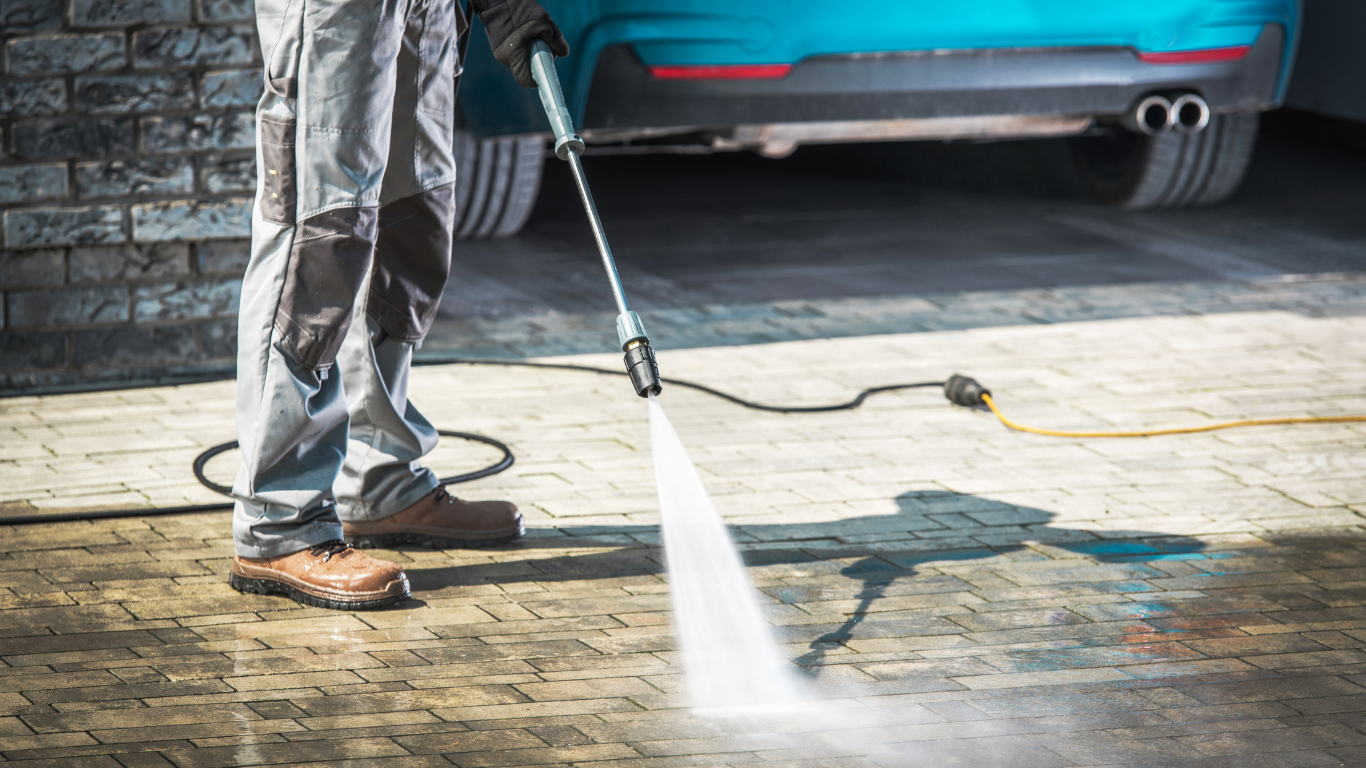 Power washing a concrete driveway in Marble Falls TX
