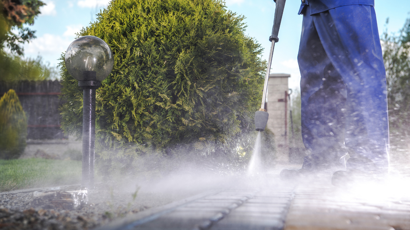 Pressure washing a concrete walkway
