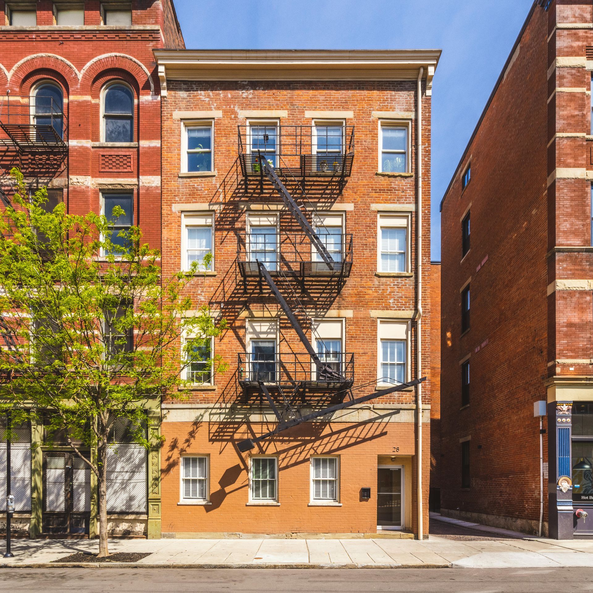 A brick building with a fire escape on the side