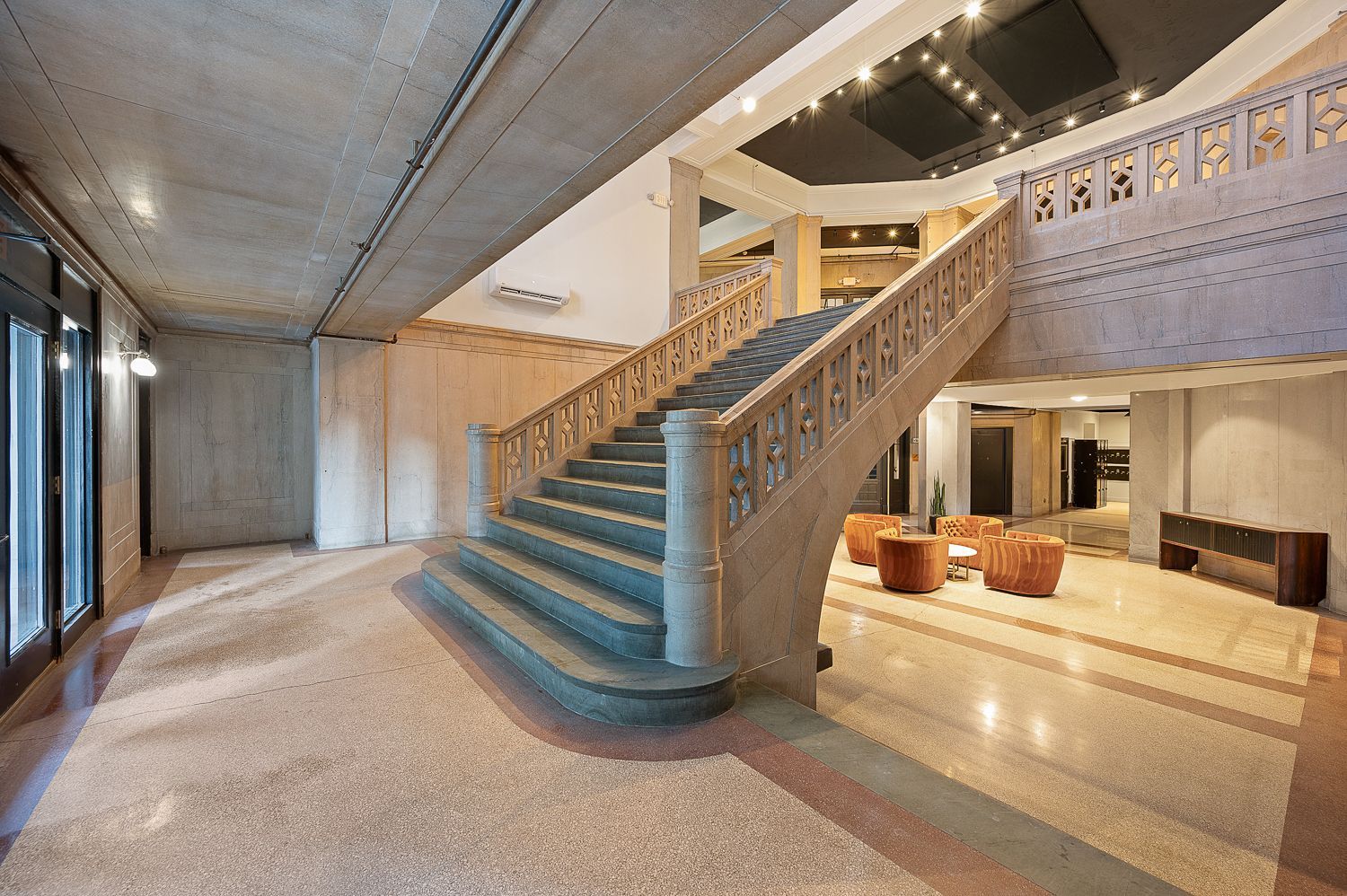 There is a large staircase in the middle of the room.
