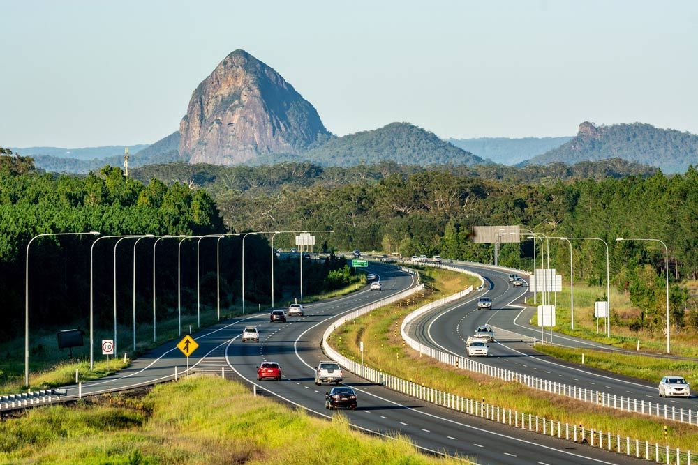 A Highway With A Mountain In The Background And Cars Driving Down It — NFL Electrical In Mount Beerwah, QLD