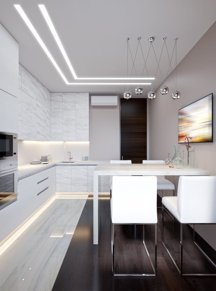 A Kitchen With White Cabinets And A Table And Chairs — NFL Electrical In Winya, QLD