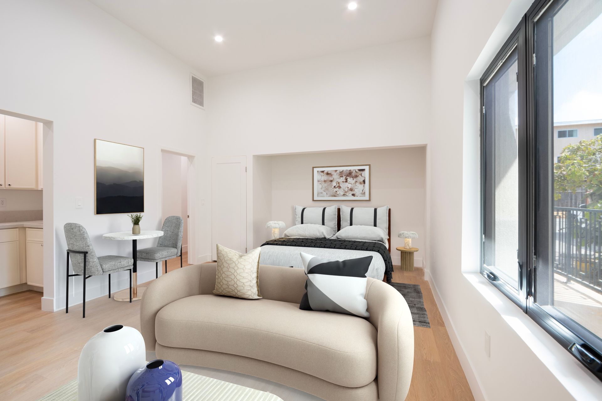 A living room with a couch and a bed in it