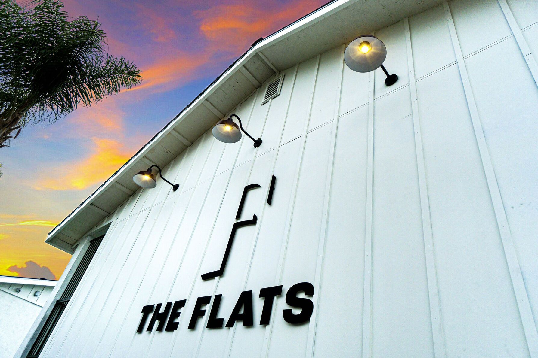 Sign showing the name of the community on the side of a building