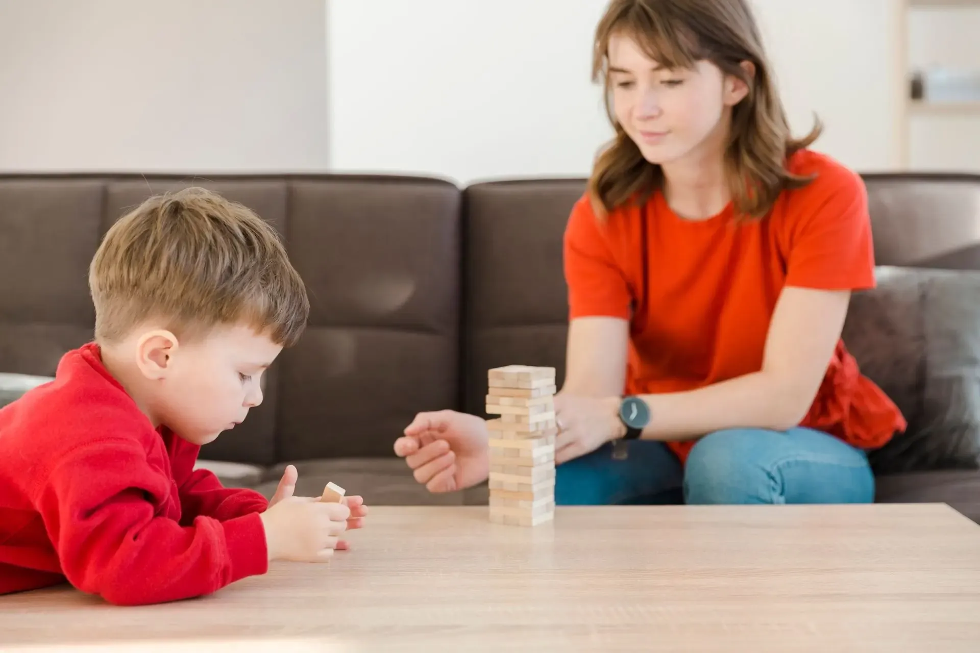 Therapist and child playing together with blocks during a session