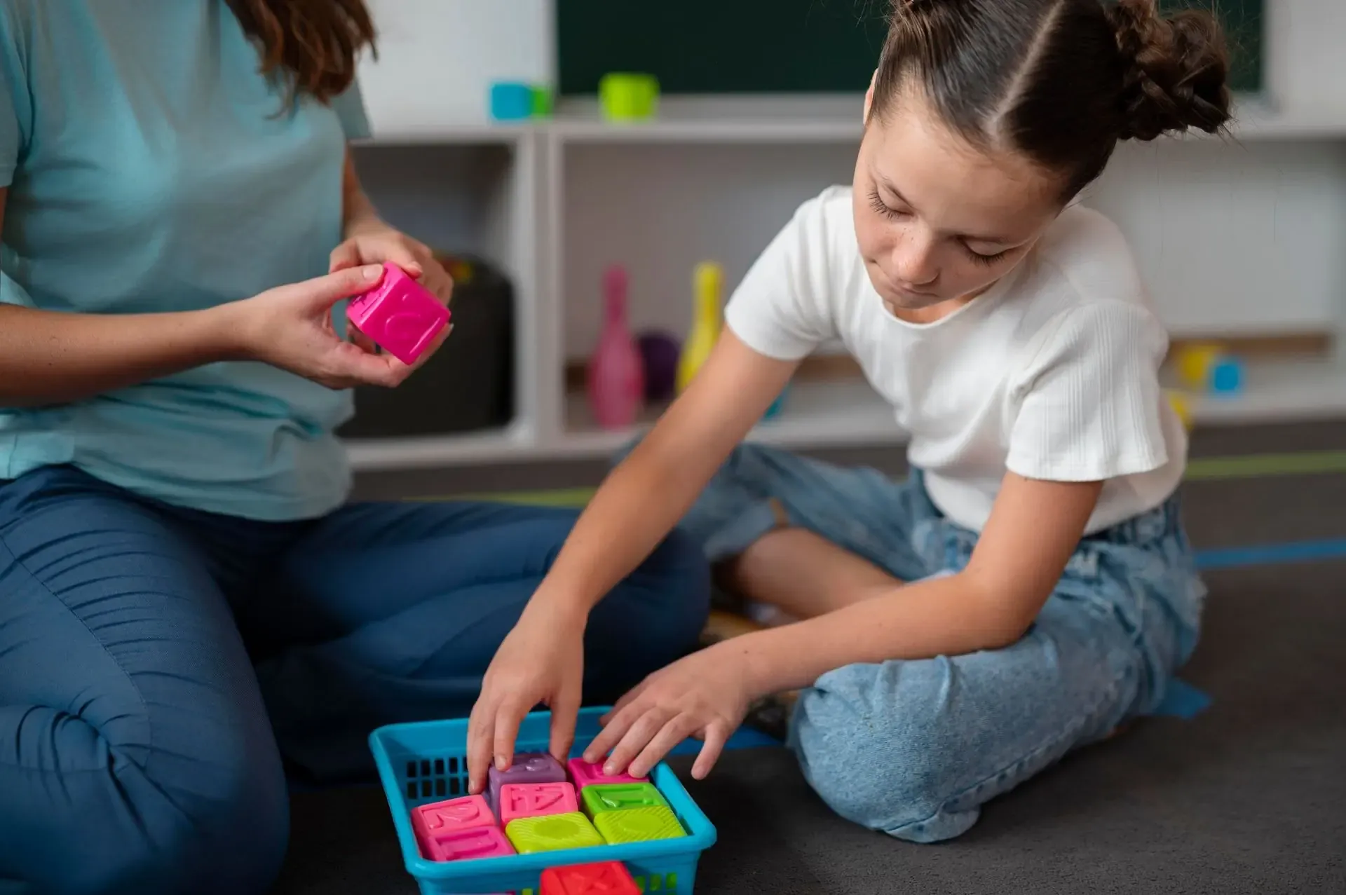 Two children playing together at the peer-play zone