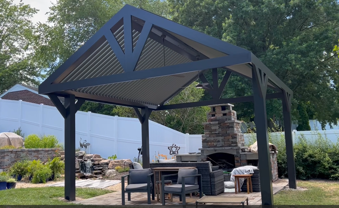 A gazebo with a table and chairs underneath it in a backyard.