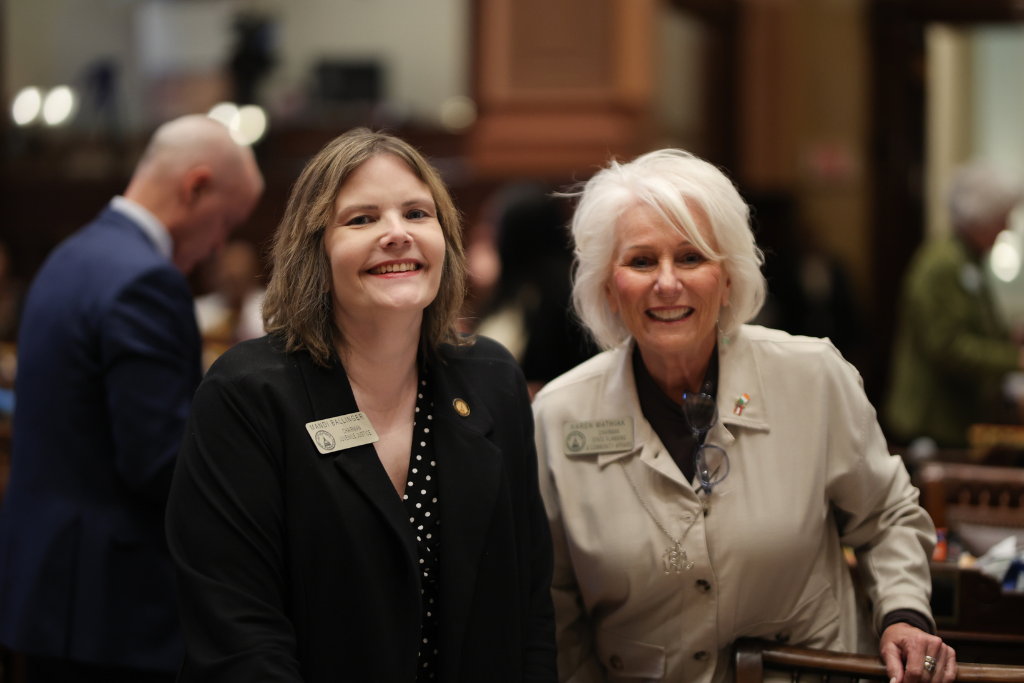 Karen Mathiak of Georgia House 82 posing with Dean Gerald Greene for a photo.