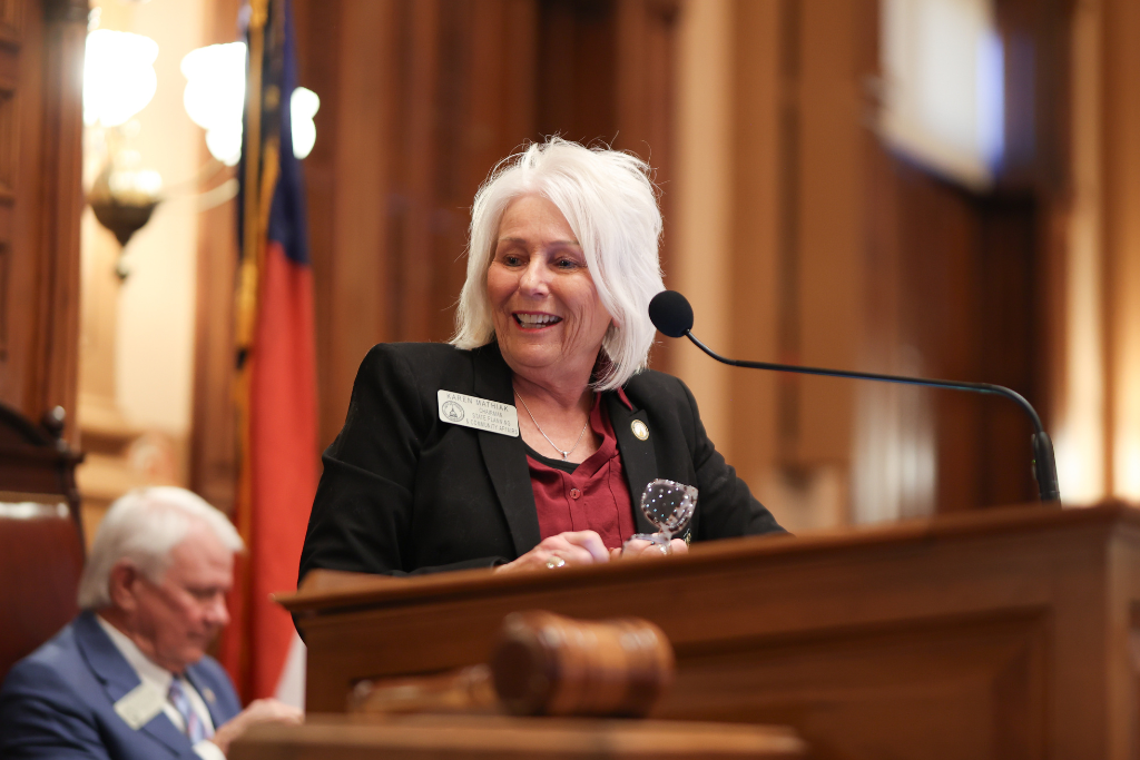 Karen Mathiak of Georgia House 82 speaking at the podium.
