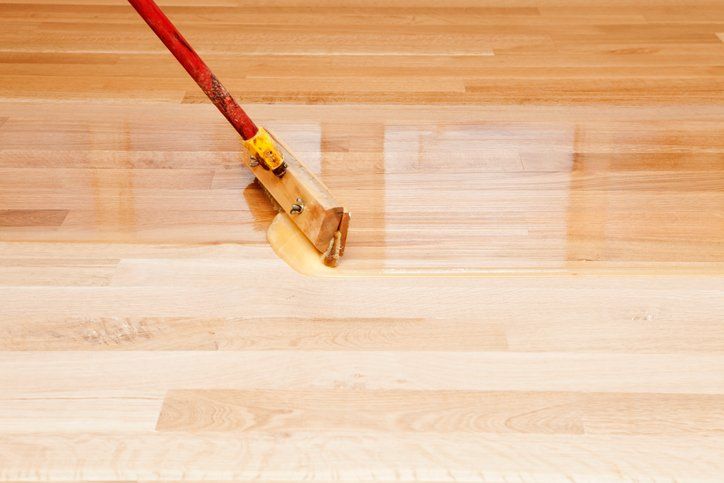 Sleek Hardwood Flooring Surface Being Cleaned