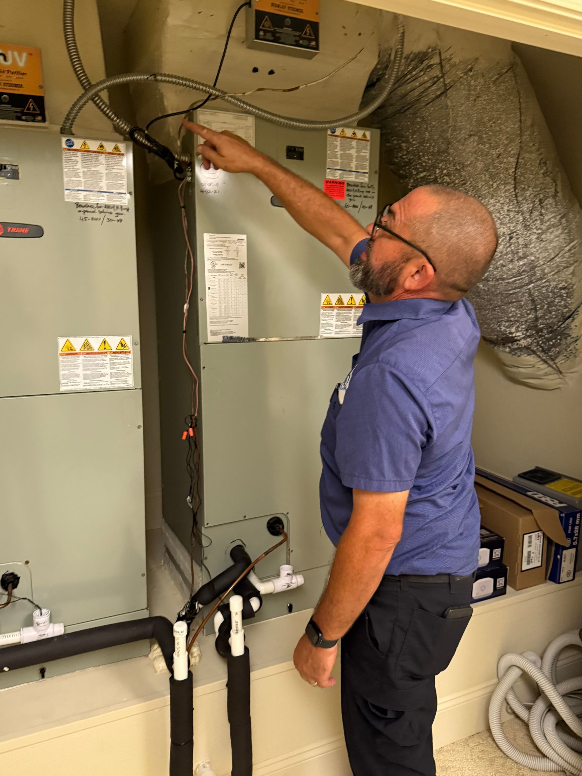 HVAC technician working on a unit