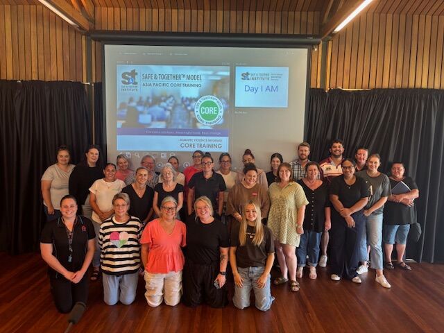 Group photos of participants in the Safe & Together Core Training