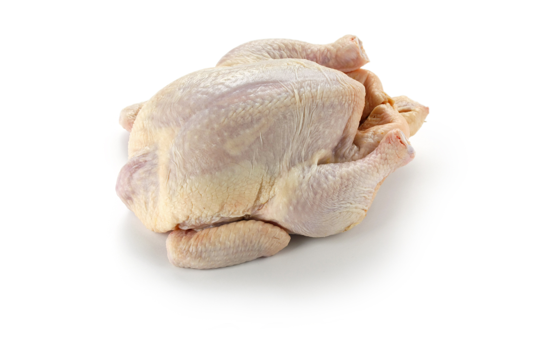 A raw, whole chicken on a white background.