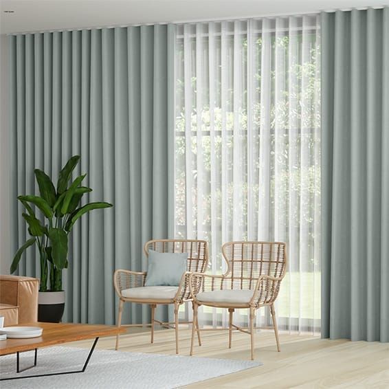 A Living Room With Two Chairs, a Coffee Table, and a Plant — Curtain Force NQ in Garbutt, QLD