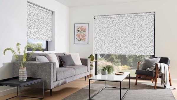 A Living Room With a Couch, Chair, Coffee Table and Blinds — Curtain Force NQ in Garbutt, QLD