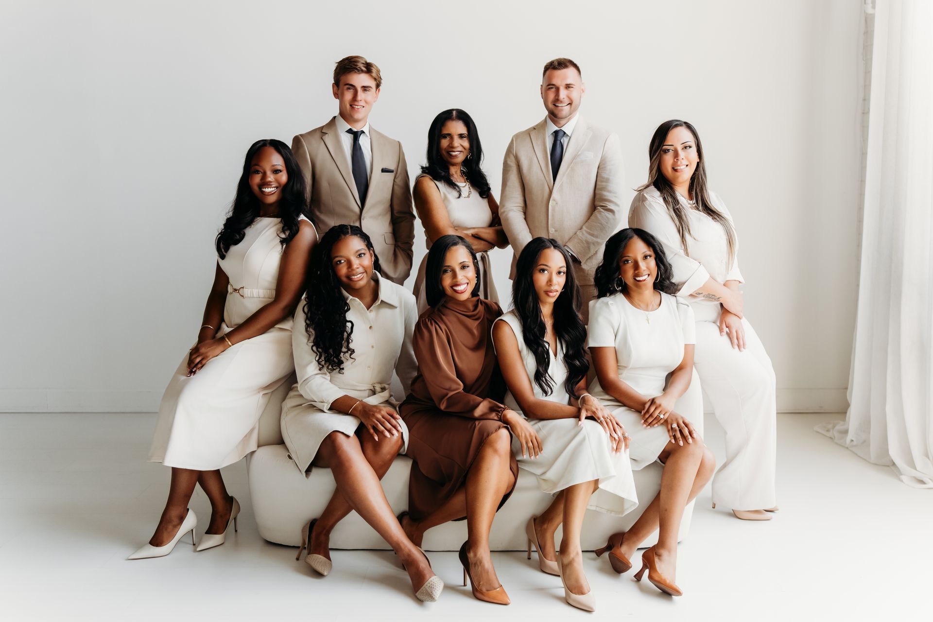 team photo of the firm sitting on a couch