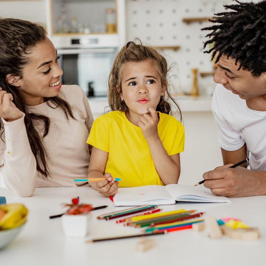 parents playing with their child