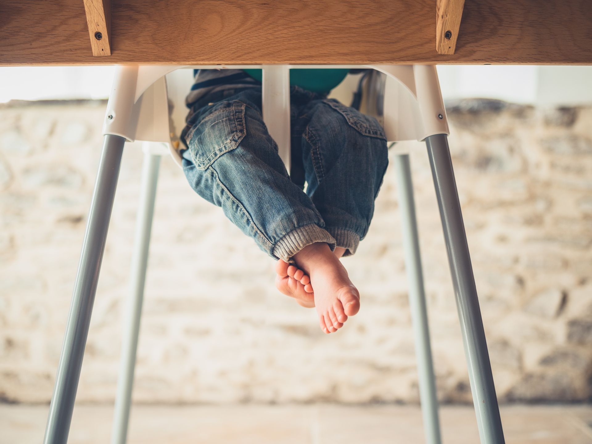 a child sitting in a highchair