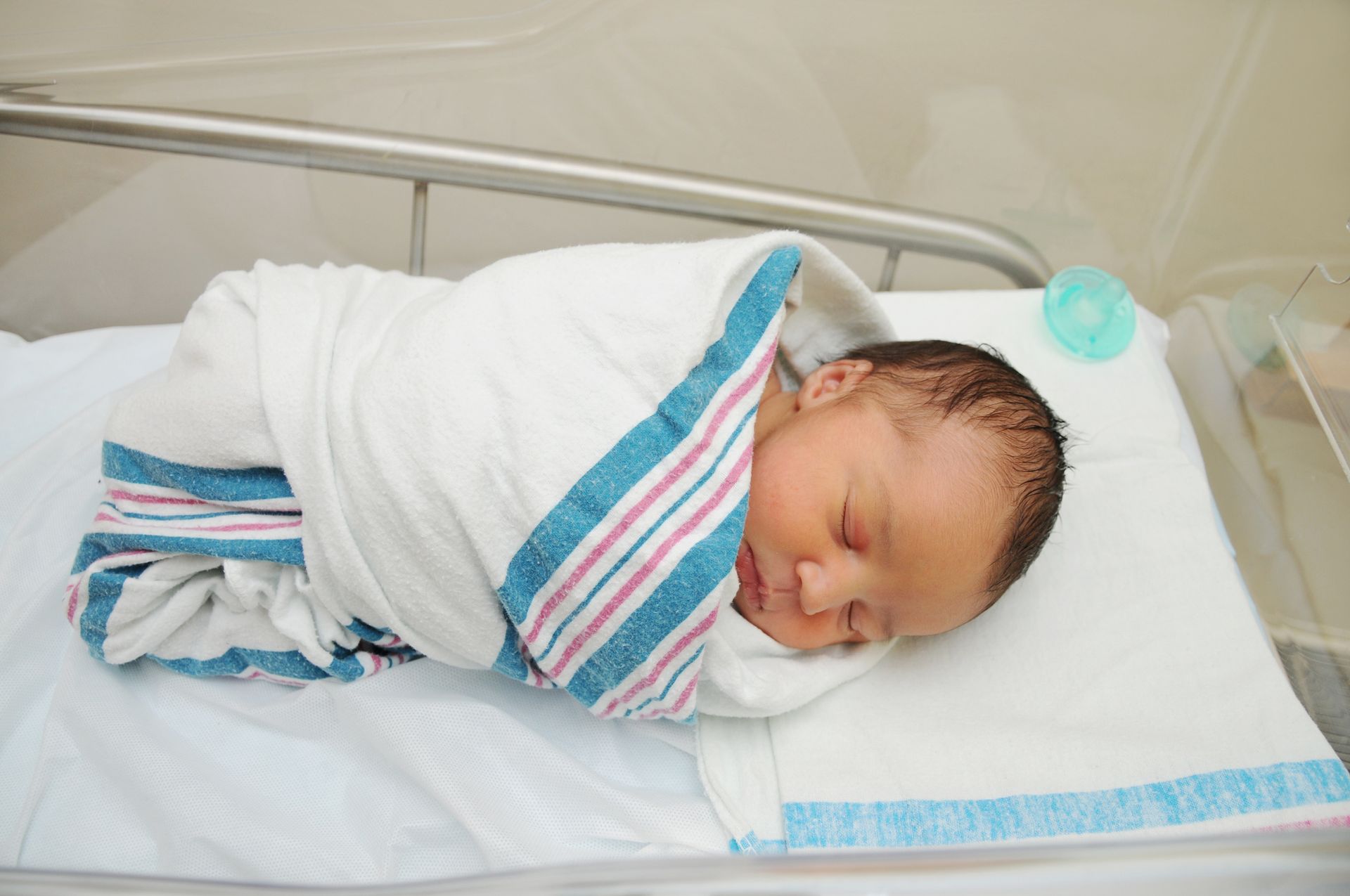 swaddled newborn baby