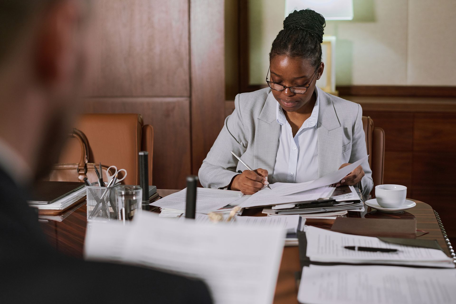 an attorney sitting at a desk reviewing legal documents