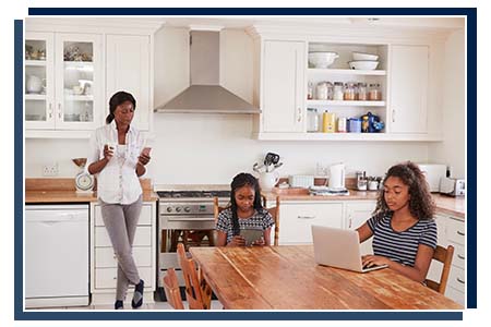 young mother and children doing homework