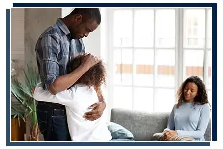 daughter hugging father during divorce negotiations
