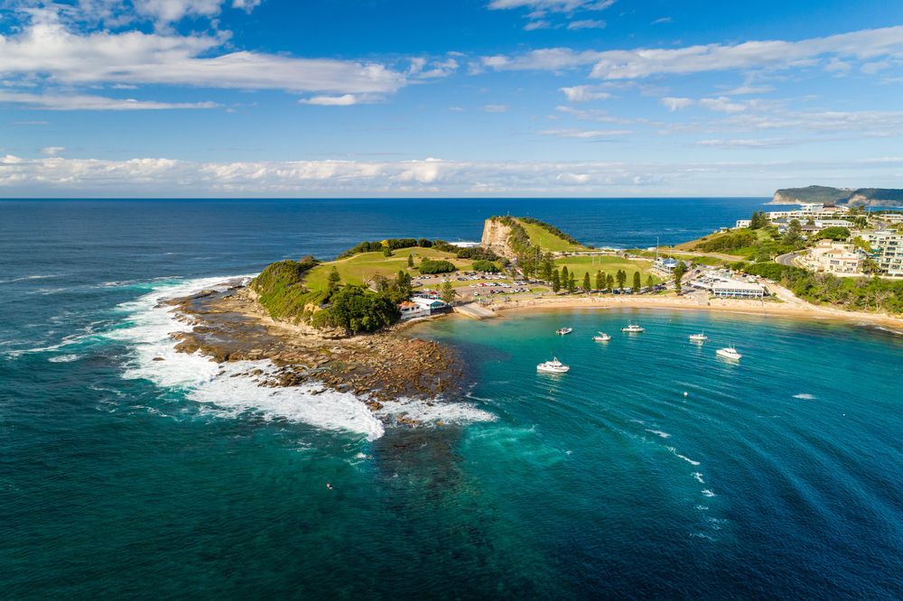 Aerial View of a Rocky Coastal Bay With Turquoise Water — Gutterworx in Terrigal, NSW