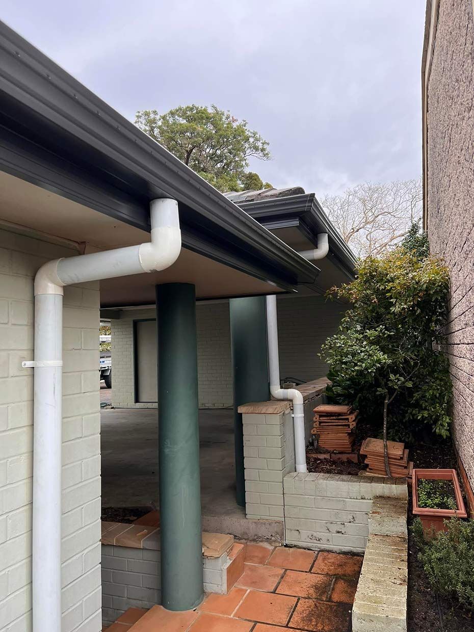 A House With a White Gutter on the Side of It — Gutterworx in Wamberal, NSW