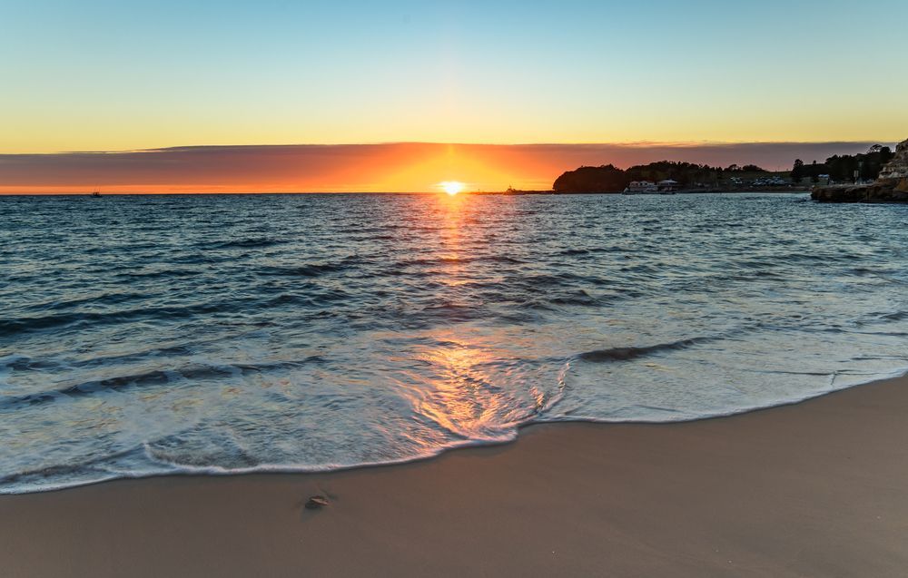 Sunset Over a Calm Beach, With Waves — Gutterworx in Berkeley Vale, NSW