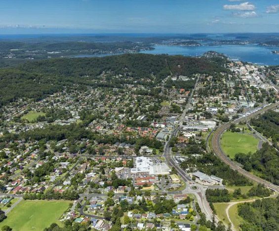Aerial View of Wyoming suburb with waterway — Gutterworx in Wyoming, NSW