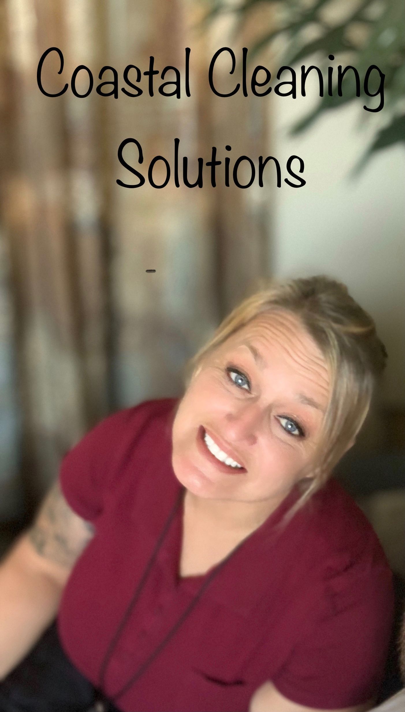 A woman is smiling in front of a sign that says coastal cleaning solutions