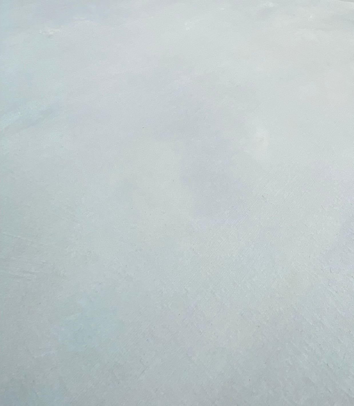 Grey concrete shed pad flooring
