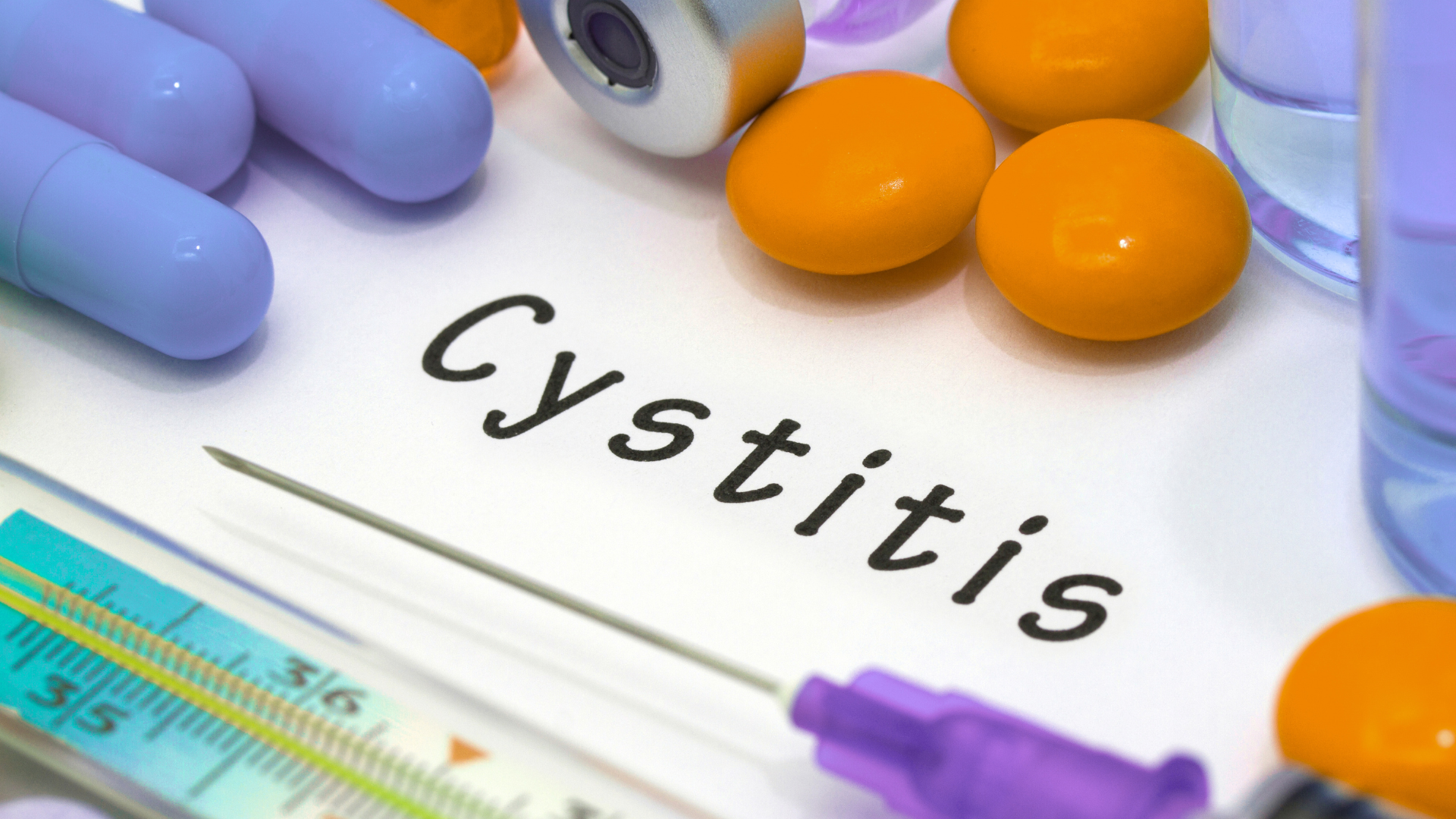 The word cystitis is written on a piece of paper