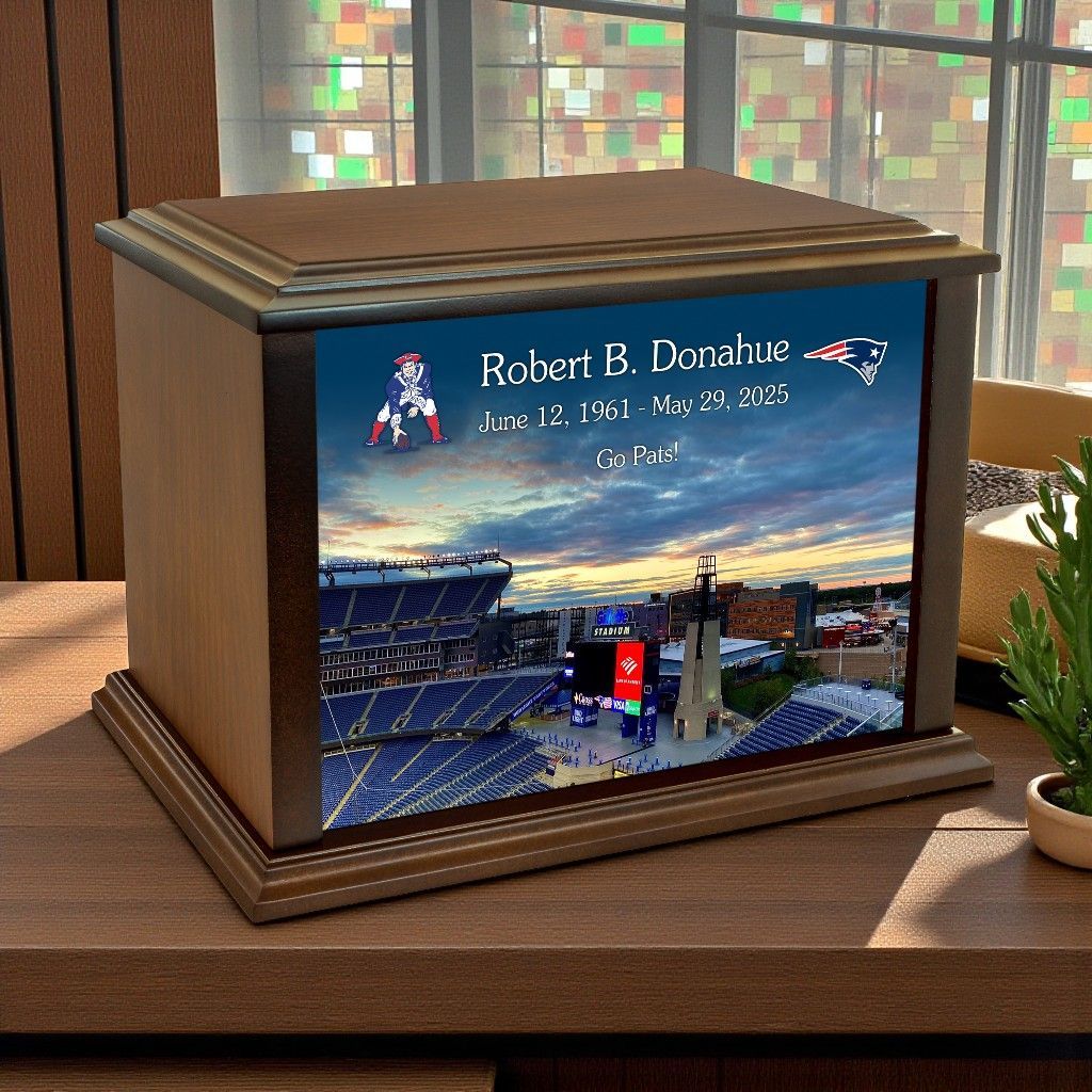 Memorial urn with a stadium photo and the name Robert B. Lombardo on the front panel