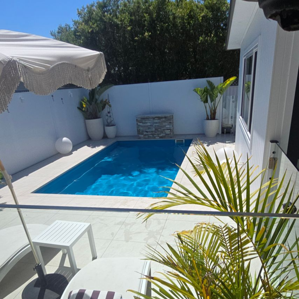 Clean Fiberglass Swimming Pool — Pool Installation in Macquarie Fields, NSW Clean Fiberglass Swimming Pool — Pool Installation in Macquarie Fields, NSW