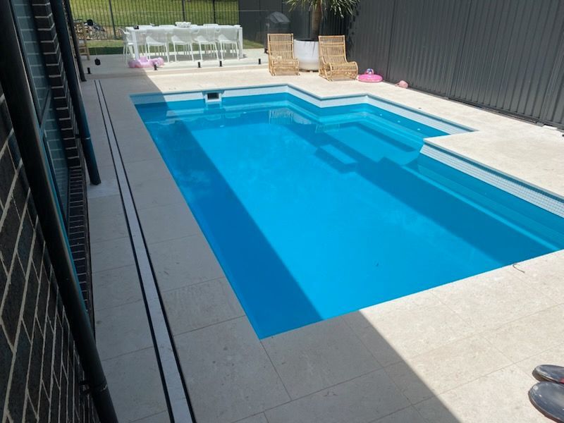 Outdoor Swimming Pool — Pool Installation in Macquarie Fields, NSW Outdoor Swimming Pool — Pool Installation in Macquarie Fields, NSW