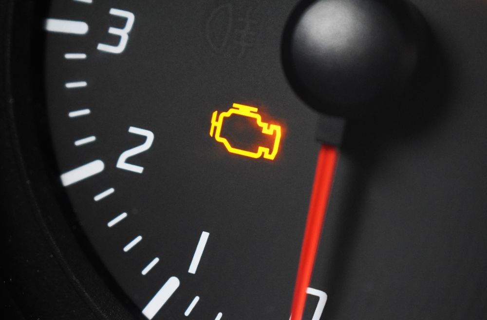 Dashboard displaying illuminated check engine light.
