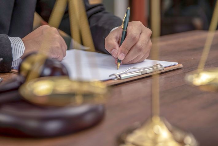 Lawyer signing legal documents