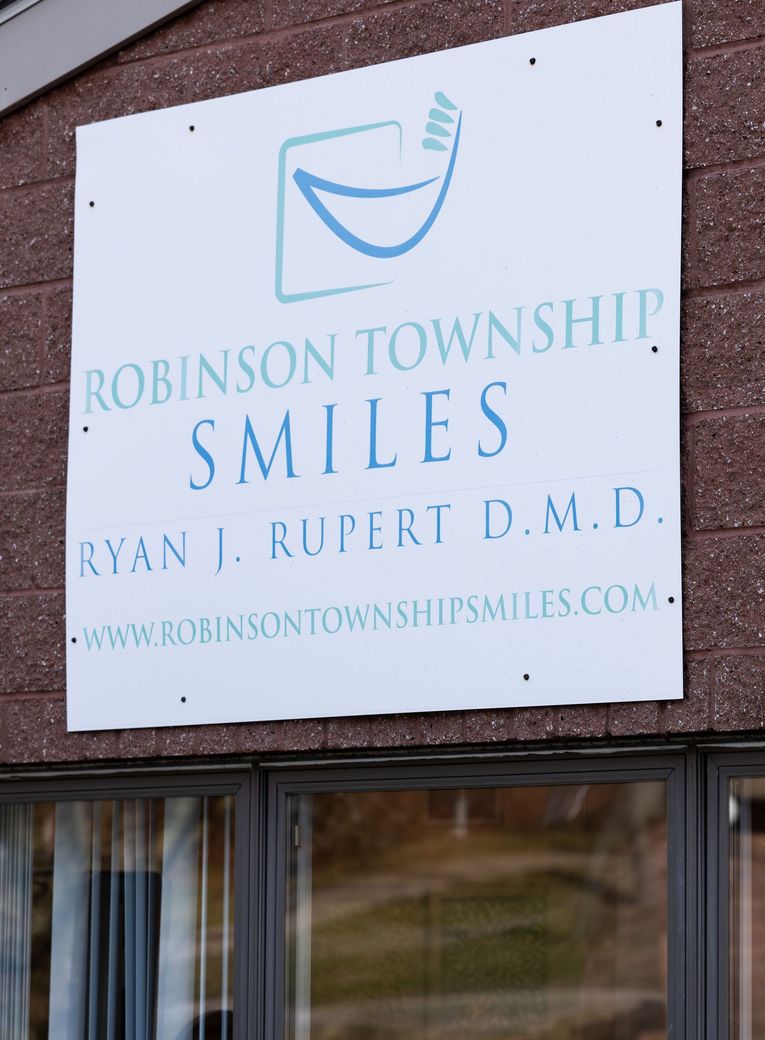 See why we are Coraopolis PA's top choice for cosmetic, emergency, and restorative dentistry. Robinson Township Smile Logo Sign Outside | Best family dentist in Coraopolis PA