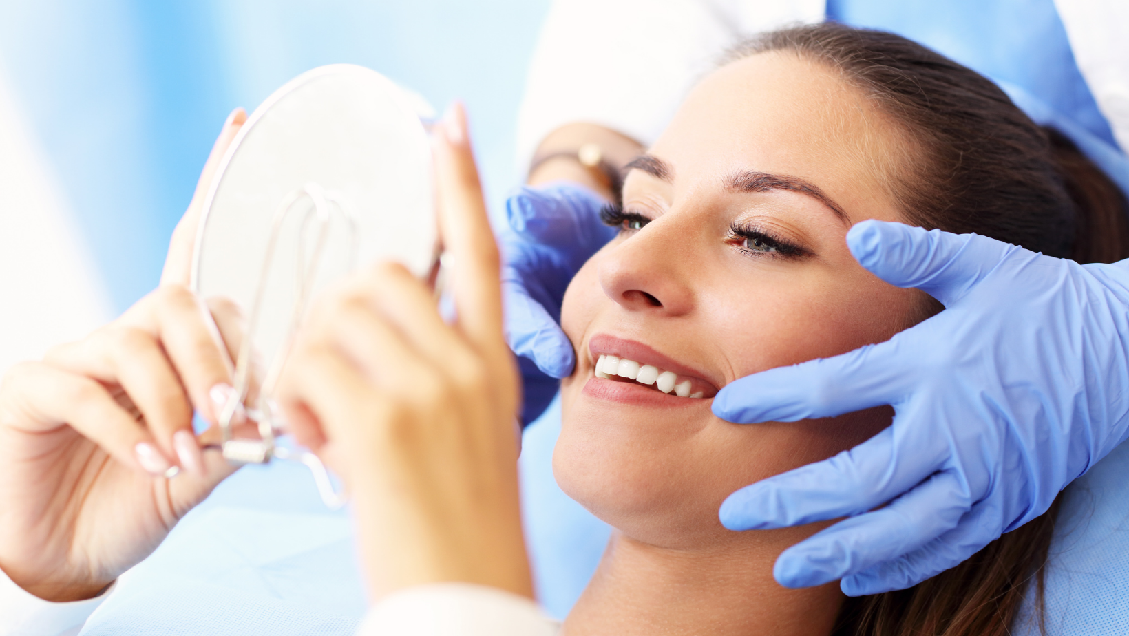 woman smiling at dentist after getting dental veneers | Cosmetic dentist Coraopolis PA