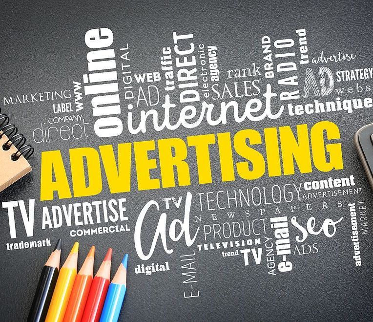 A blackboard with the word advertising written on it