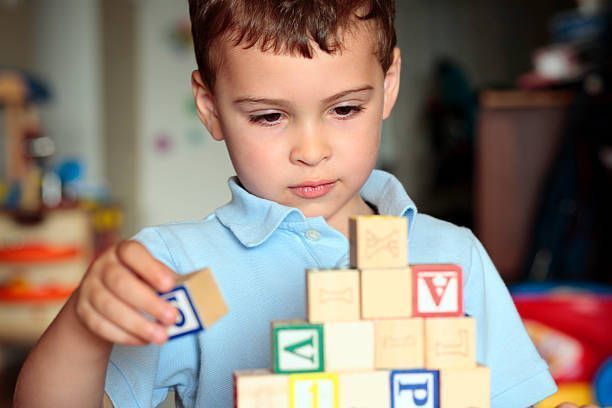 Child Playing with Letter Boxes - Pendleton, IN - Assent Therapy ABA