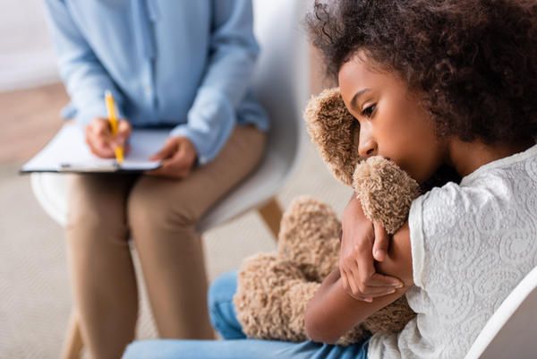 Girl is Hugging a Teddy Bear - Pendleton, IN - Assent Therapy ABA