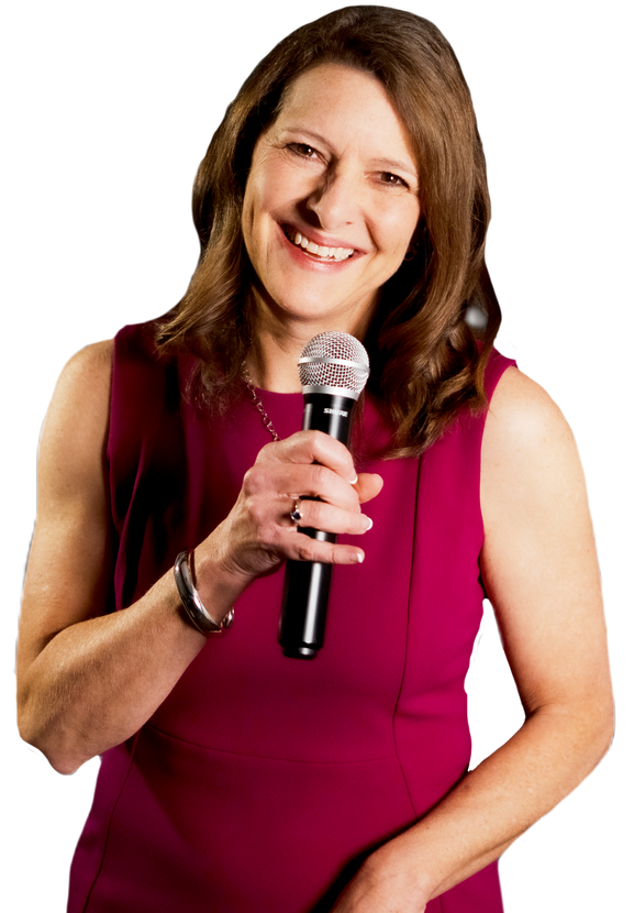 Smiling woman in a magenta dress holding a microphone against a white background