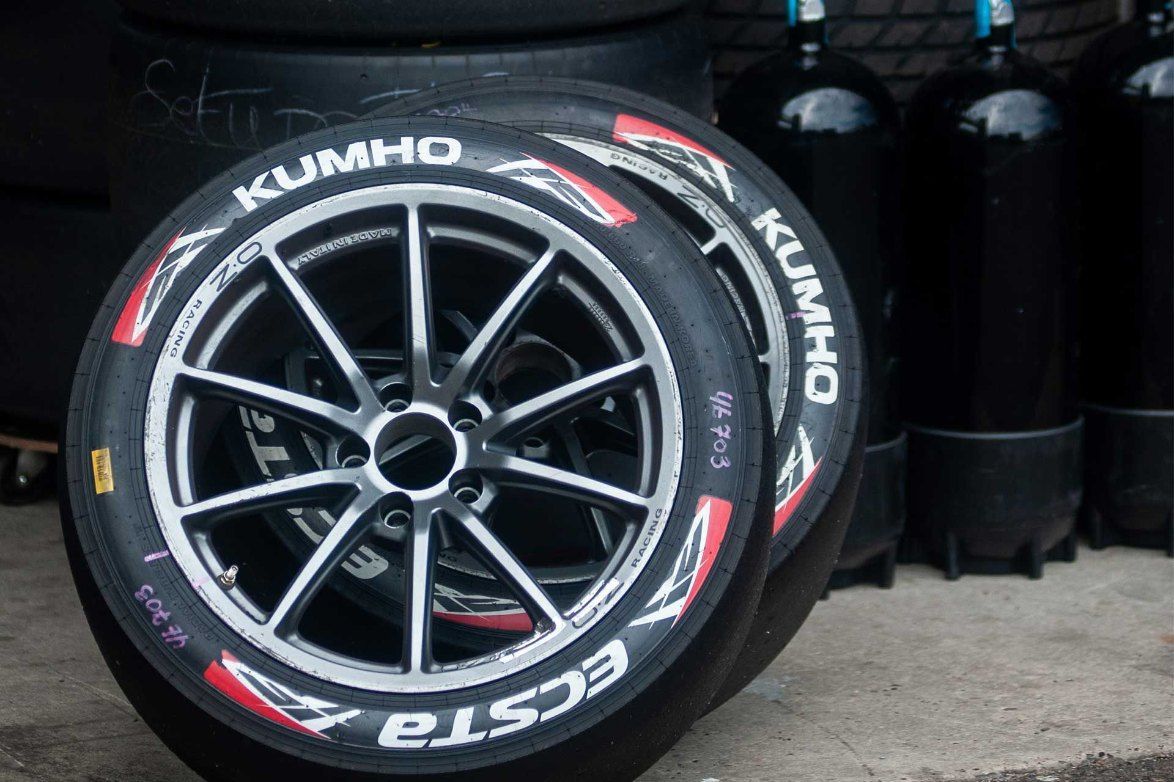 Two Kumho Ecsta Tires Are Stacked on Top of Each Other — All Care Car Services Kumho Tyre Platinum Dealer in Kurri Kurri, NSW